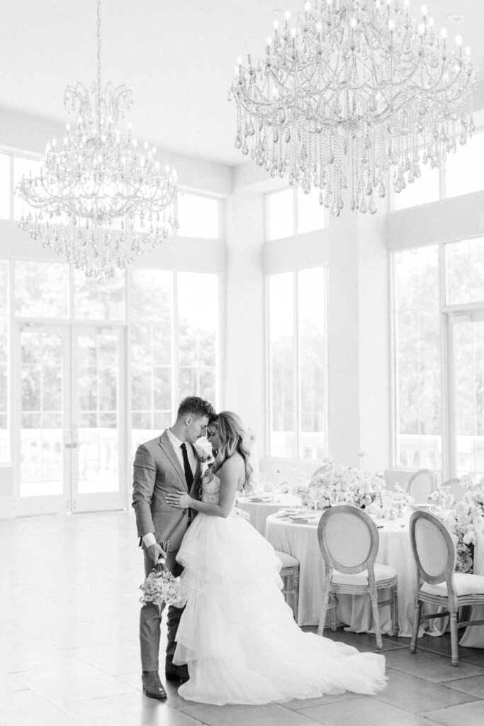 black and white romantic bride and groom embrace