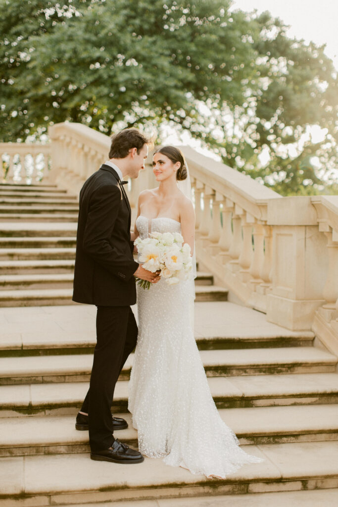 Golden hour wedding portraits of couple looking lovingly at each other