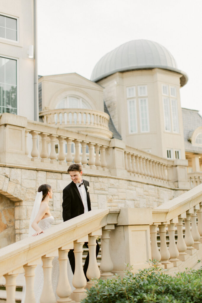 Tender golden hour moment with groom looking at bride's face lovingly