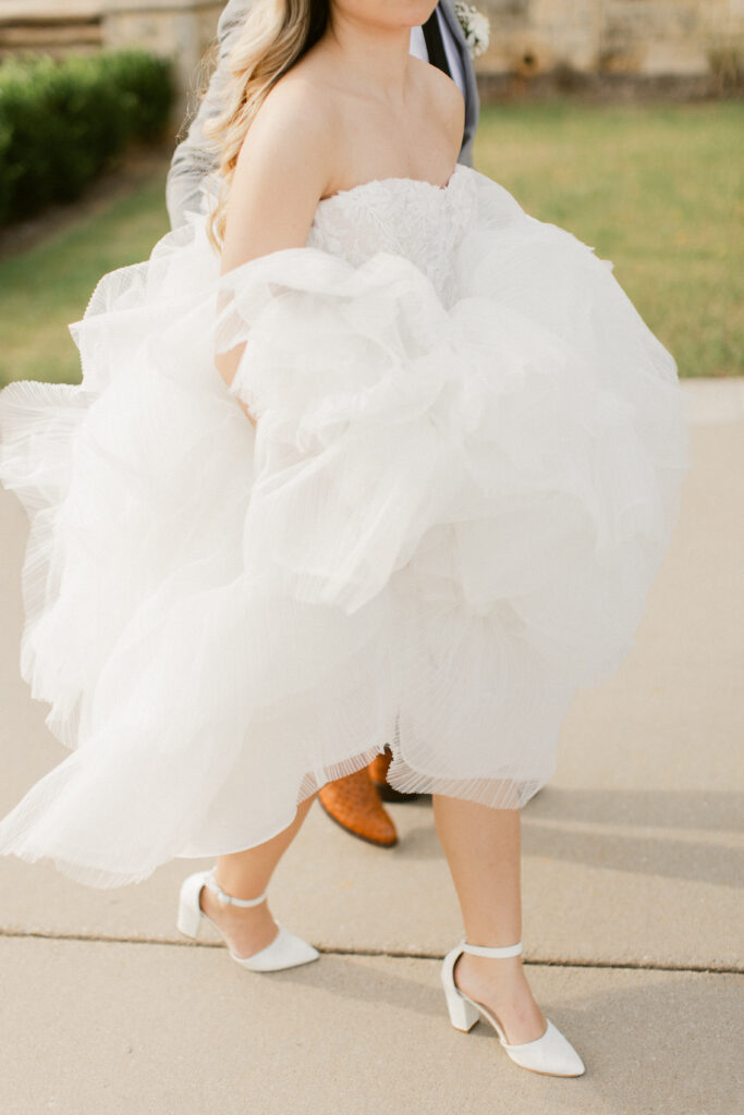Close up of bride's dress while walking outdoors at The Olana