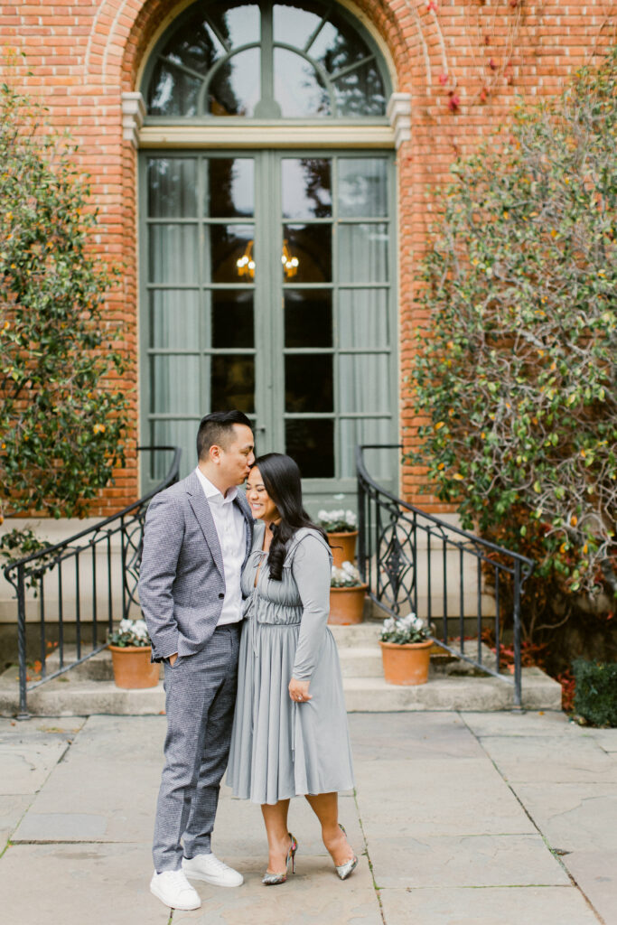 Close-up portrait of couple framed by autumn ivy at Filoli