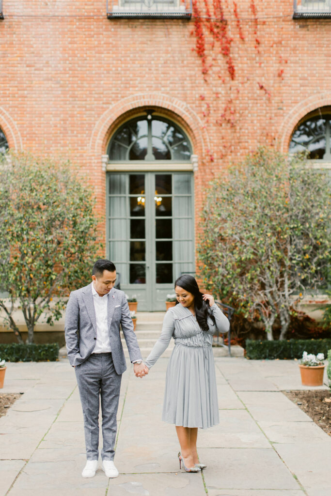 Couple walking slowly through Filoli estate in fall
