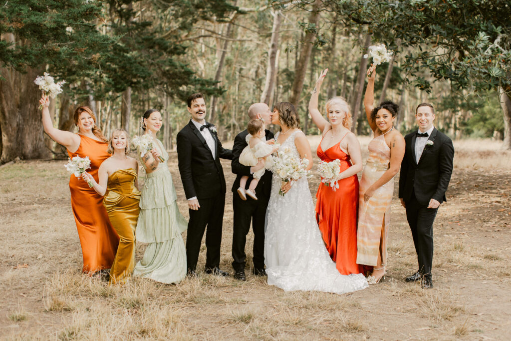 Candid moment of the entire wedding party before the Flood Mansion wedding