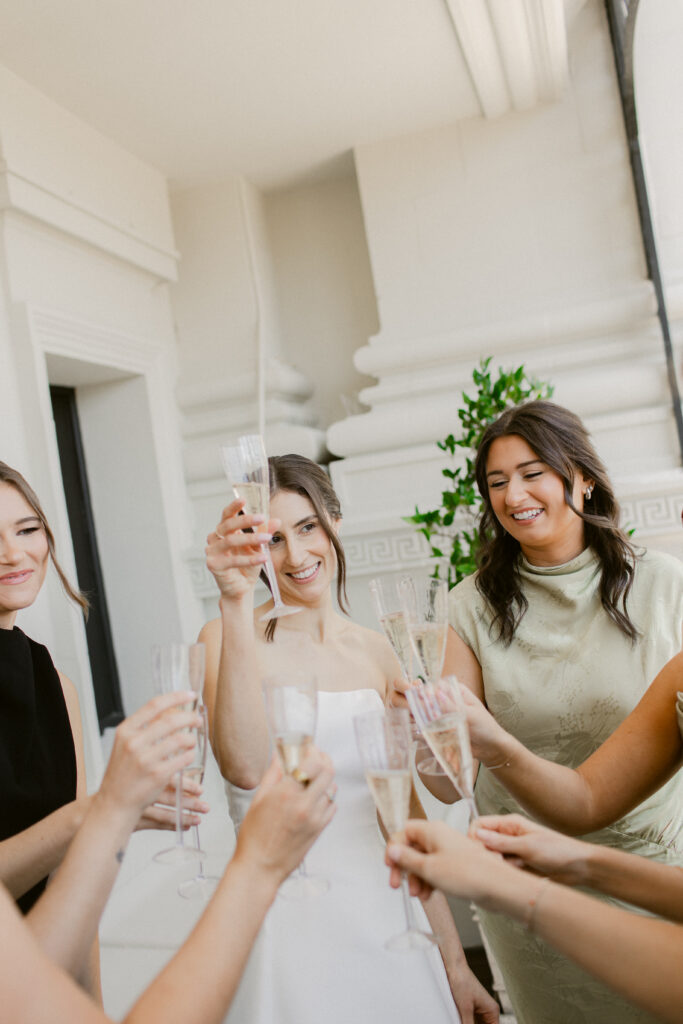 Bride and bridesmaids toasting